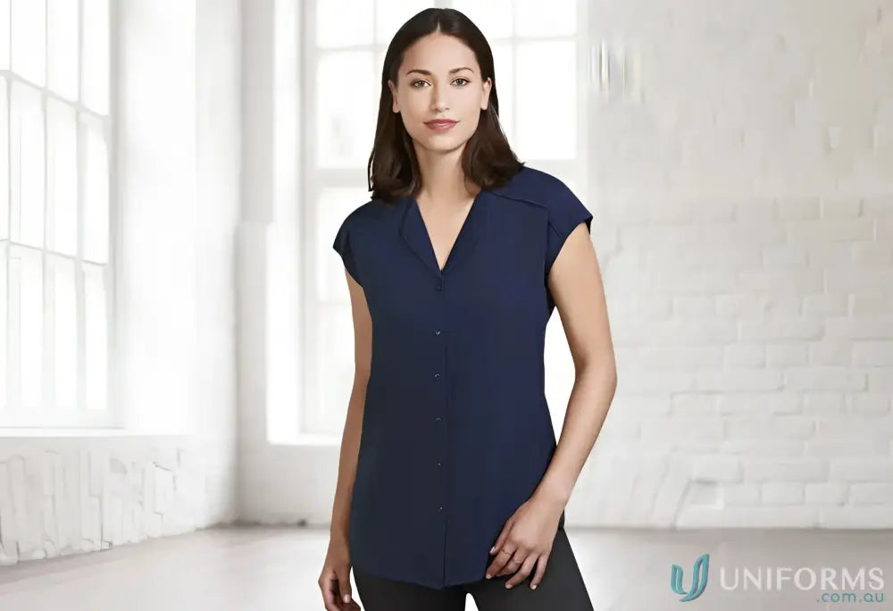 Woman wearing navy Lily Ladies Blouse with petal-shaped lapel from Biz Collection Lily