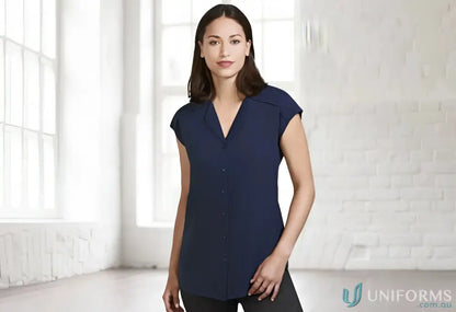 Woman wearing navy Lily Ladies Blouse with petal-shaped lapel from Biz Collection Lily
