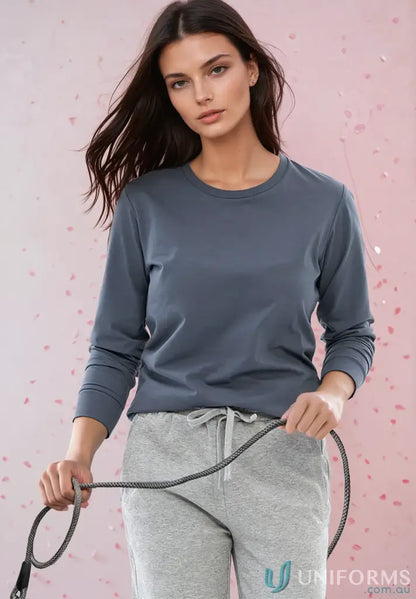 Women wearing Ladies Premium Carey LS Tee in cotton face fabric with patterned pants