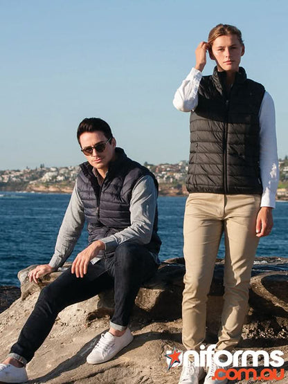 Two people wearing stylish ladies puffer vests with recycled polyester insulation