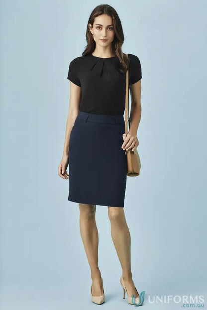 Woman in black short-sleeved top and dark blue pencil skirt, perfect workwear uniform