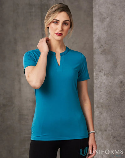 Woman wearing Sofia Ladies Knit Top with inset V-neck tab, perfect for winning spirit ladies