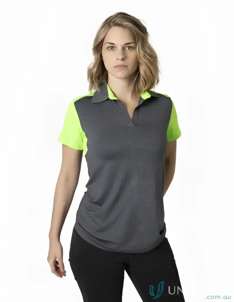 Woman in Ladies Soft Touch Shoulder Polo with neon yellow trim and cooldry tech