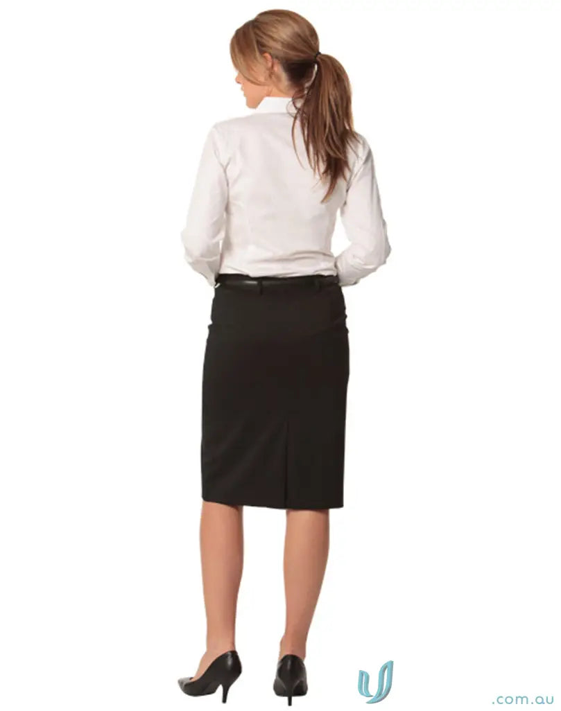 Woman in white shirt and black mid-length pencil skirt with heels from behind
