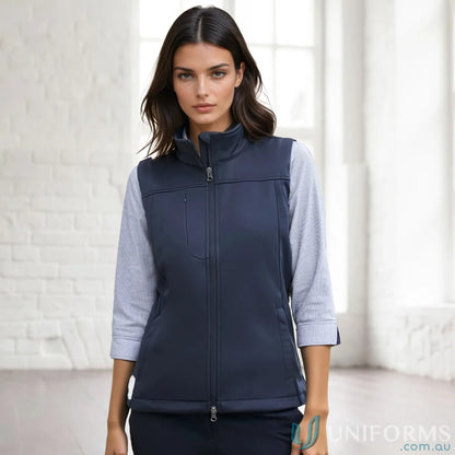 A woman’s navy blue sleeveless vest with a full zipper closure and a stand-up collar.