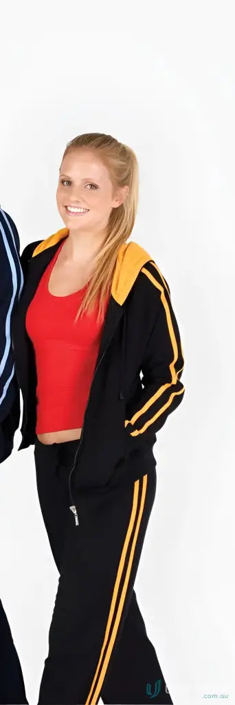 Woman wearing Ladies Unbrushed Fleece Sweater with black tracksuit and red top
