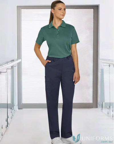 Woman in dark teal polo and navy cargo pants showcasing Ladies Utility Cargo m9480
