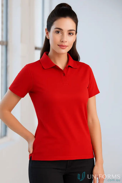 Woman wearing Ladies Verve Polo in red with CoolDry® polyester mini fabric