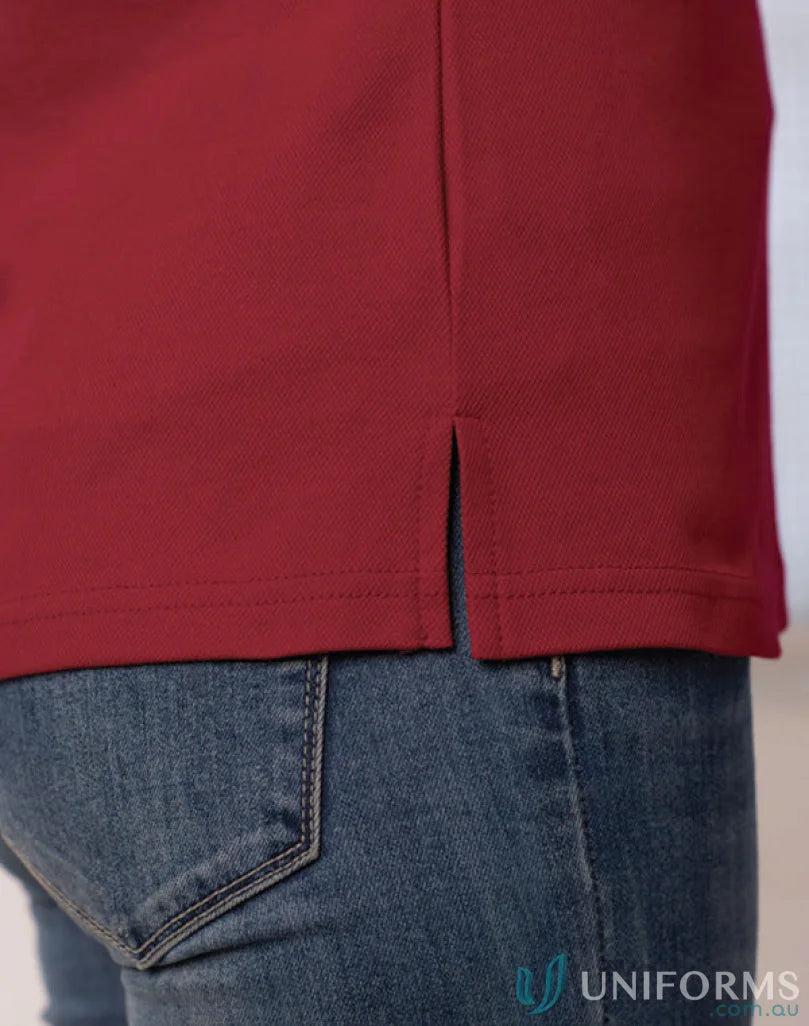Lady wearing Maroon Ladies Victory SS Polo with side slits made of cooldry polyester