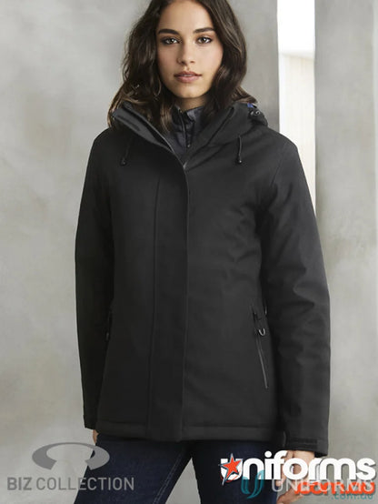 Lady wearing Ladies Waterproof Eclipse Jacket with waterproof zippered pockets and detachable hood