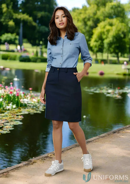 Woman in denim shirt and navy Lawson Cotton Stretch Skirt from Biz Collection Women’s