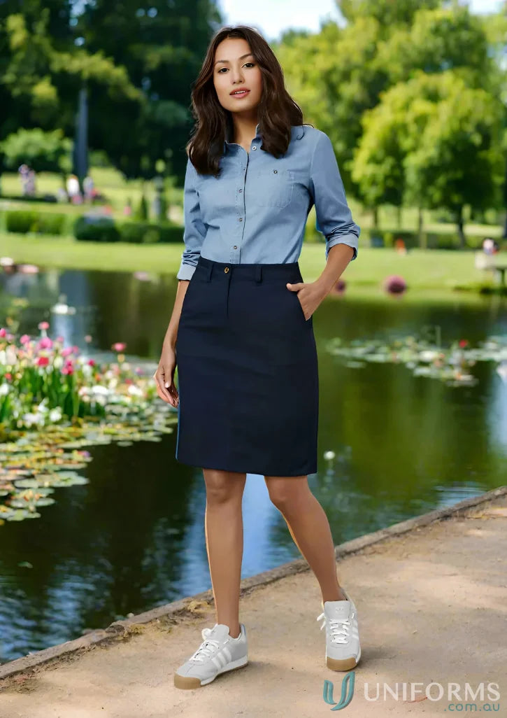 Woman in denim shirt and navy Lawson Cotton Stretch Skirt from Biz Collection Women’s