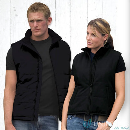 Two people wearing black uniforms showcasing the stylish Legacy Vest workwear for professionals