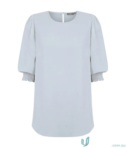 Light blue Lola Shirred Cuff Top in premium luxe twill fabric with puffed sleeves