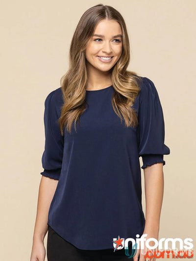 Navy blue Lola Shirred Cuff Top made of premium luxe twill fabric with ruffled sleeves