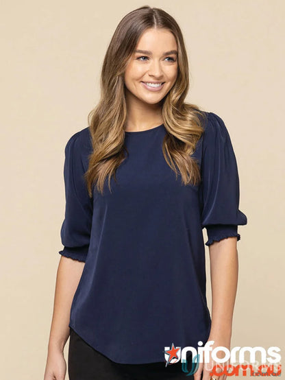 Navy blue Lola Shirred Cuff Top made of premium luxe twill fabric with ruffled sleeves