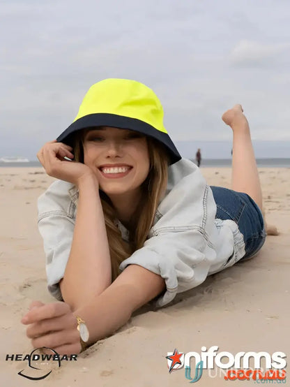 Woman in Luminescent Safety Bucket Hat with denim, perfect for workwear uniforms
