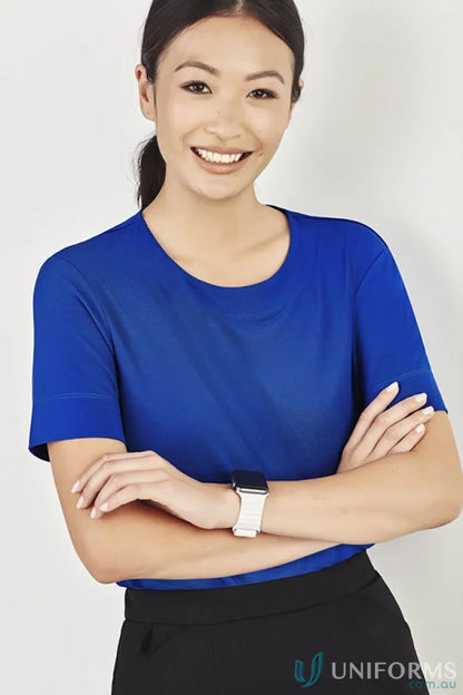 Smiling woman wearing Bizcare Marley Soft Jersey T-Top in blue, women’s marley short style