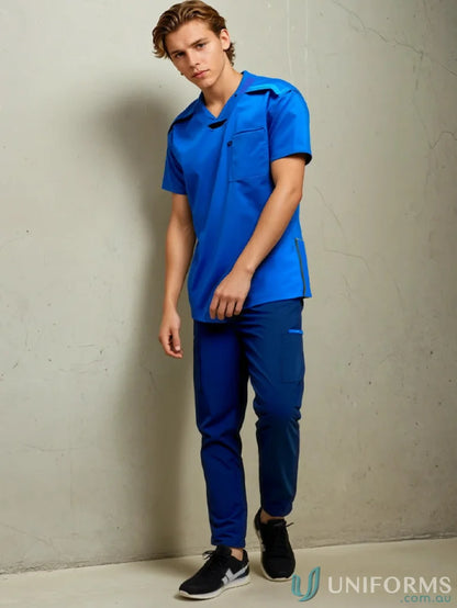 Man in blue Medi8 Unisex Stretch Scrub Top with women’s stretch for healthcare pros