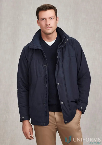 Man wearing Melbourne Comfort Jacket by Biz Collection in navy blue, perfect for light showers
