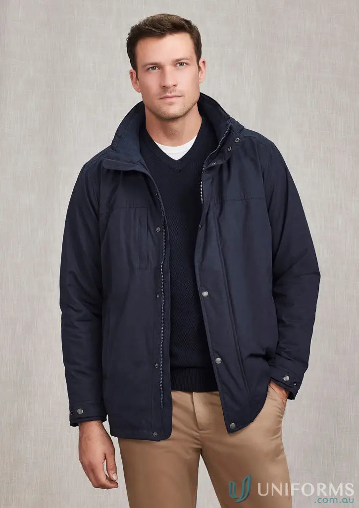 Man wearing Melbourne Comfort Jacket by Biz Collection in navy blue, perfect for light showers