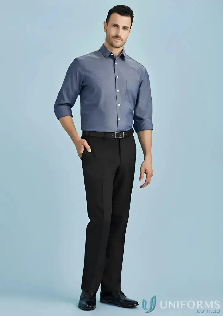 Man modeling blue long-sleeve shirt with black workwear pants, perfect for work uniforms