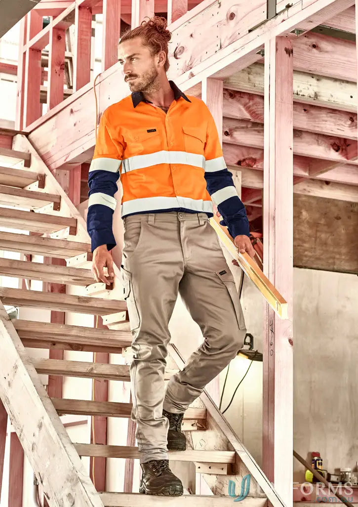 Male model wearing men’s essential basic stretch cargo pants with work shirt and boots