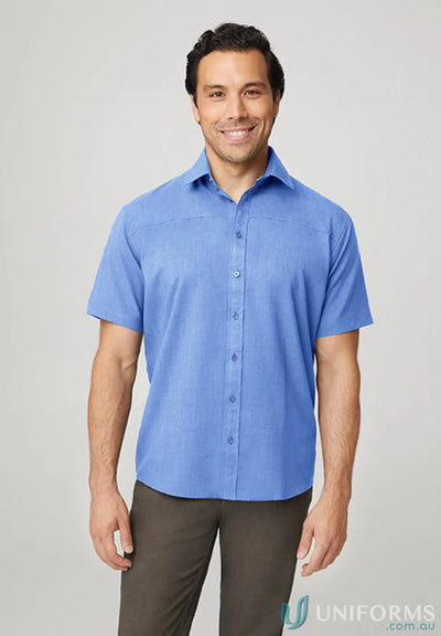 Smiling man in blue short sleeve shirt, perfect for casual wear or sports uniforms