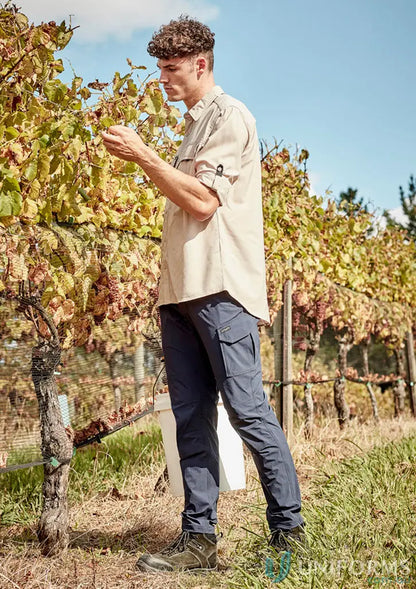 Man in vineyard wearing Mens Lightweight Outdoor Pant with large cargo pocket for ultimate comfort