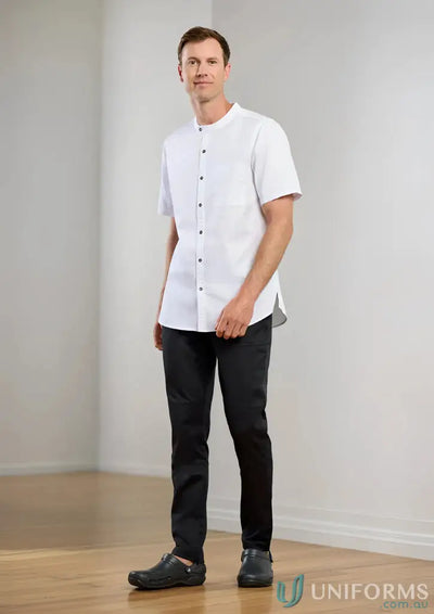 Man in white tunic and black pants wearing Mens Saffron Chef Flex Pant for professional style