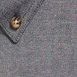 Gray wallet with gold corners in short sleeve industrial chambray shirt