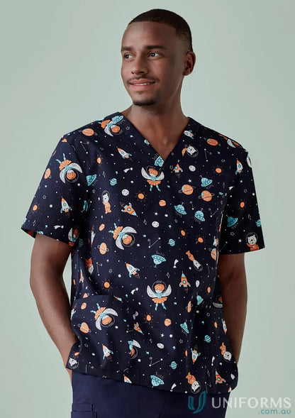 Man in space-themed scrub top from Bizcare Men’s Printed line, perfect for early learning educators