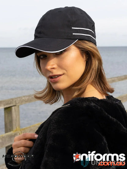 Black microfibre sports cap with white piping, perfect for your outdoor activities
