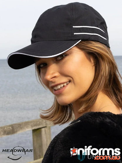 Black microfibre sports cap with white piping, perfect for casual wear