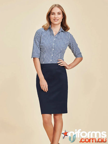 Woman wearing a striped shirt and navy Mid Waist Traveller Stretch Chino Skirt rgs264l