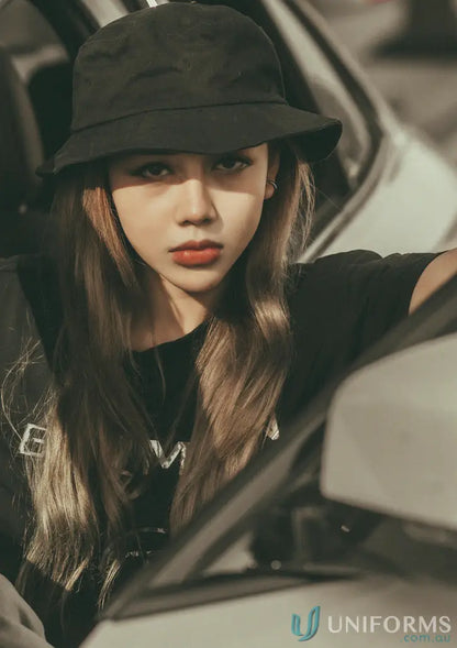 Young woman in black Mildura ELC Bucket Hat from stock range with high inch wide centimeters