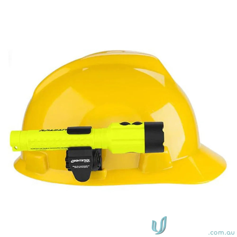 Yellow hard hat with flashlight attached using Multi-Angle Helmet Mount for accessory slot or brim