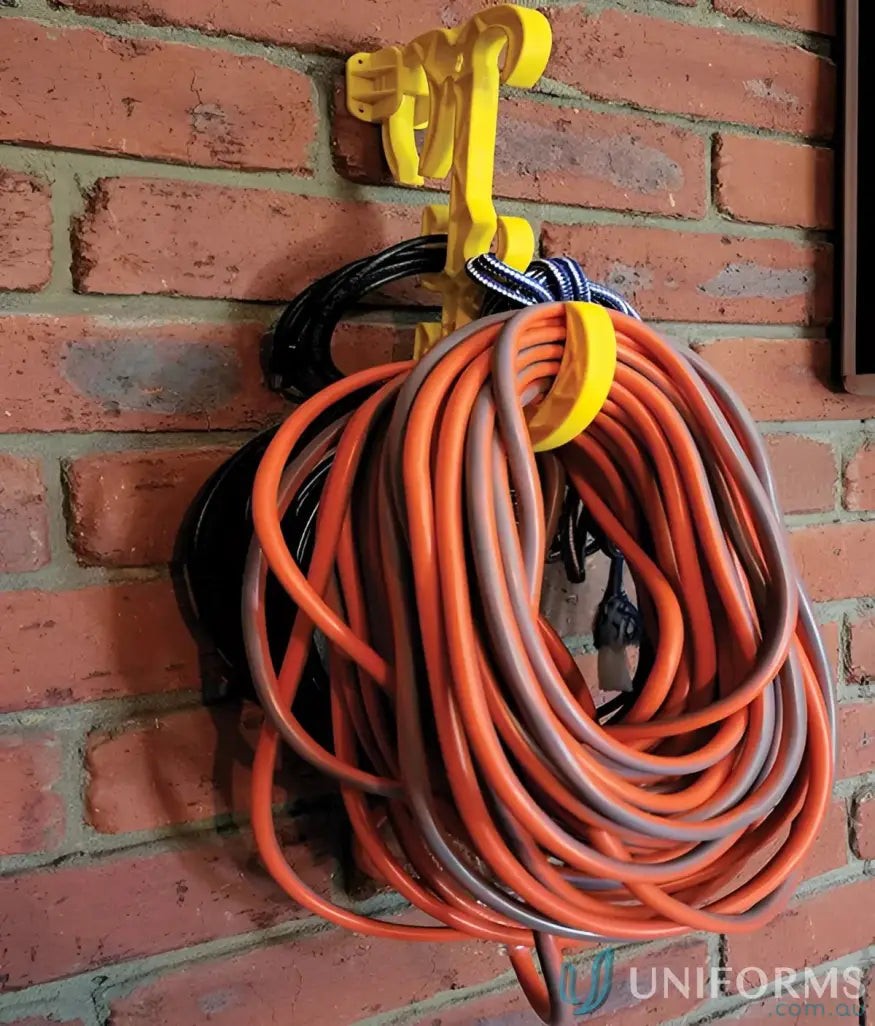Coiled orange and black electrical leads on Yellow Suspension Hook for uniforms and tools