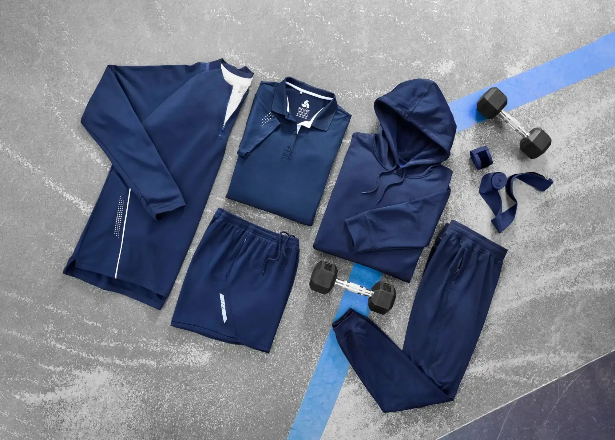 Navy athletic apparel and weights.