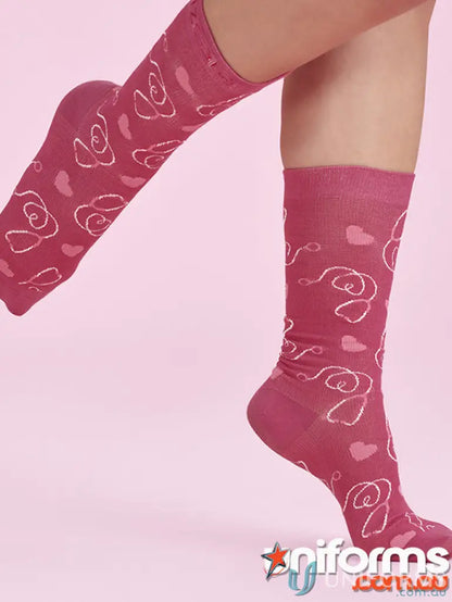 Pink happy feet NBCF Comfort Socks with heart and swirl patterns for cozy feet