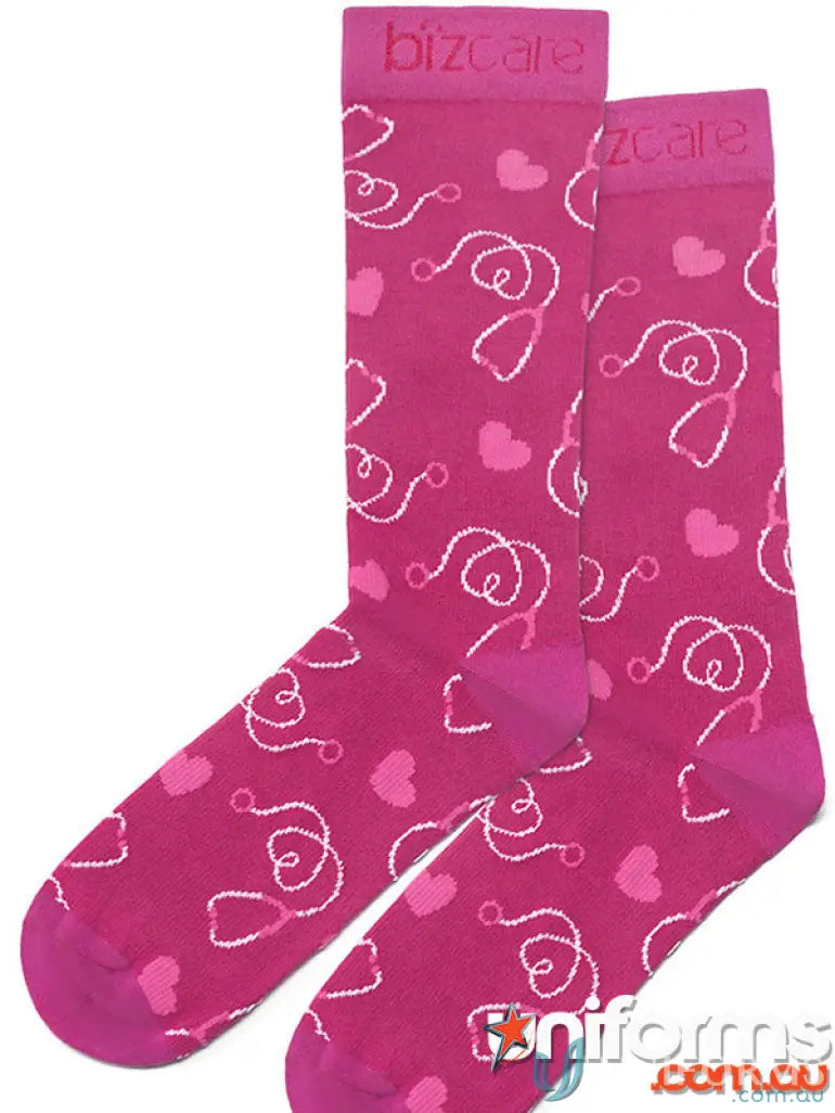 Pink happy feet comfort socks with white stethoscopes and pink hearts for cozy feet