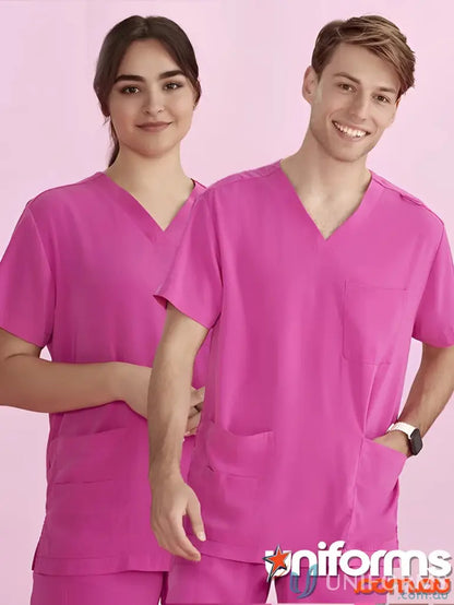 Two people wearing NBCF Unisex Pink V-Neck Scrub Top, style Cst250us in pink