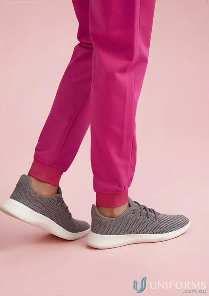 Pink jogger scrub with gray sneakers from Bizcare Women’s Pink NBCF Scrub Pant -CSP241LL