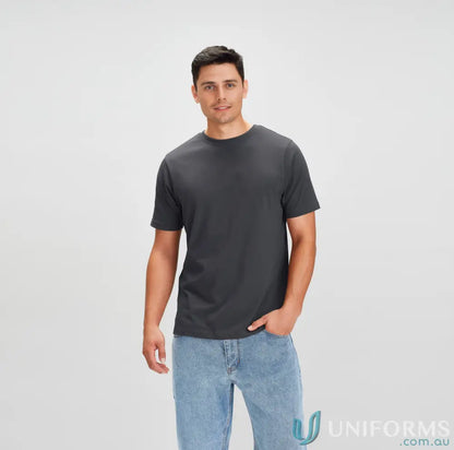 Man wearing dark gray Newport Tee from Biz Collection with light blue jeans