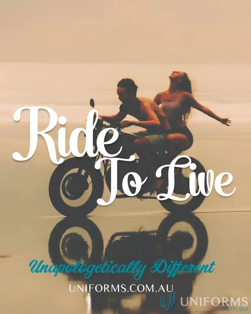 A couple riding a motorcycle on the beach in a Newport Tee from Biz Collection