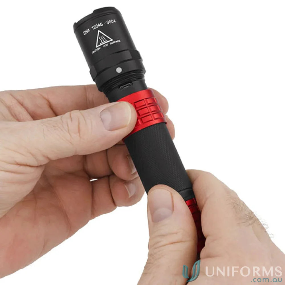 Red and black tactical flashlight with IP-X7 waterproof design and cordura holster