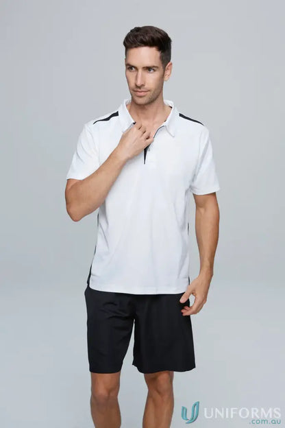 Man in white Polo shirt and black shorts wearing Paterson Polo workwear uniform