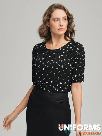 Woman wearing Petal Print Knit blouse with city collection petal skirt in recycled polyester