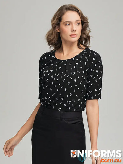 Woman wearing Petal Print Knit blouse with city collection petal skirt in recycled polyester