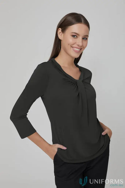 Woman modeling Pippa Ladies 3qtr Top in dark green with tie-neck, stylish sleeve blouse